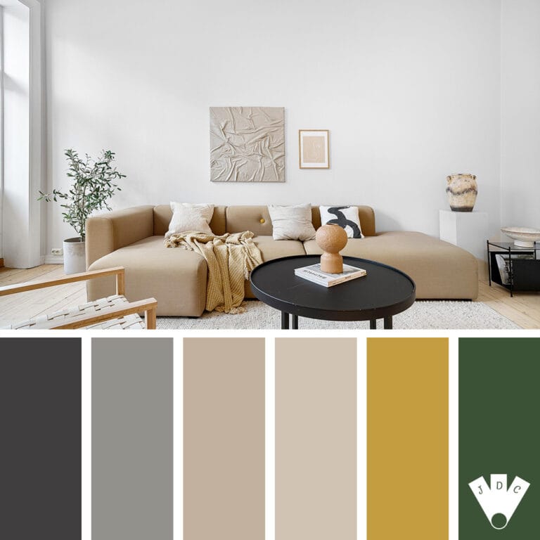 Salon minimaliste avec canapé beige, table noire et décoration chaleureuse dans des tons naturels.